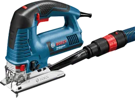 よりきれいな切断作業のために集塵ホースに接続された電動ジグソー。.