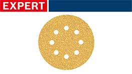 金色のサンディングディスク、中央に穴があり、背景は青と赤。